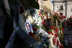 People gather next to Salvador Allende statue on September 11, 2019 to offer floral tributes