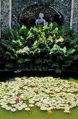 Pond with water lilies and statue at Isola Madre Botanical Garden