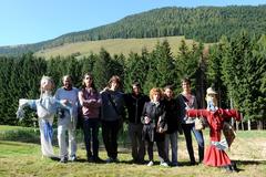 Group photo with scarecrows at the Alpine Botanical Garden Viote