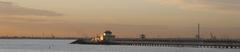 St. Kilda Pier with moored boats and Melbourne skyline in the background