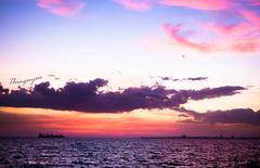 solitary boat on a vast ocean