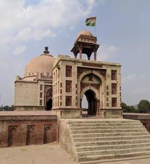 Side view of the entrance and stairs leading to a historic tomb