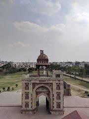 view of a city through the terrace of a tomb