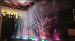 waltzing water fountains illuminated at night