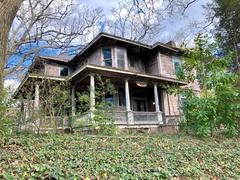 Grant Park in Atlanta with lush green lawns and trees lining the picturesque Cherokee Avenue, showcasing the beautiful urban landscape.