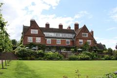 Winterbourne House in Birmingham with a garden path and greenery