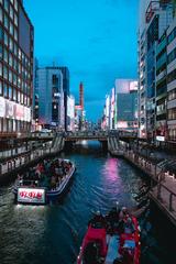 Boats on Dotonbori Canal at night