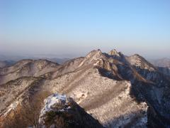 Scenic view of Gyeryongsan mountain range with lush green forest and clear blue sky