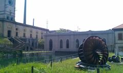 Centrale idroelettrica di Crespi d'Adda in provincia di Bergamo with buildings of the Crespi cotton mill on the left