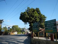 Castillejos town center with commercial establishments and vehicles