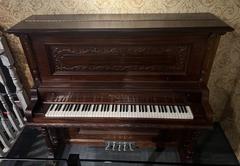 The Cash family piano in a room