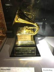 Johnny Cash holding a Grammy Award