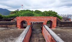 Cihou Fort with traditional Chinese architectural style and red tiles at the peak of Cihou Mountain