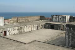 Main battery of Fort Qihou in Kaohsiung, Taiwan showing two cannon emplacements with Taiwan Strait in the background