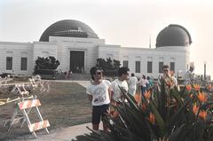 Three people standing together at Griffith Observatory, 1990