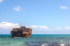 Scenic view of Rocky Cay beach with clear blue skies and calm waters.