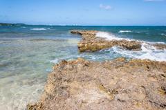 Rocky Cay at sunset with clear blue waters