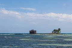 Rocky Cay beach with vibrant blue sea and rocky outcrop