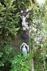 Wrought iron crucifix on a medieval pedestal in Kishartyán, Hungary