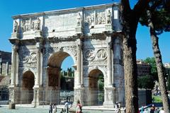 Arch of Constantine in Rome with people walking nearby