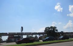 Clearview Parkway Elmwood Louisiana with freight train on rail ramp