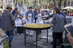 Paella at Plaça de la Reina during Falla Tio Pep festival in Spain