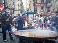 Spanish folklore festival with traditional paella cooking