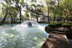 Parque España in Mexico City with lush greenery and monument