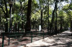 Parque España entrance with monument and lush greenery, Mexico City