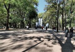 statue in Parque España in Mexico City, surrounded by green trees