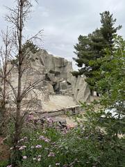 Denver Zoo entrance with visitors and palm trees