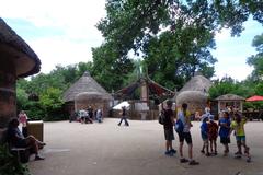 giraffe standing in a zoo enclosure