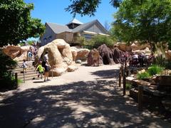 entrance of Denver Zoo featuring sculptures and colorful decorations