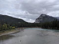 Mountainous landscape with a river and buildings in Banff