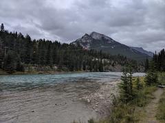 A scenic view of Banff National Park with a lake surrounded by mountains and forests