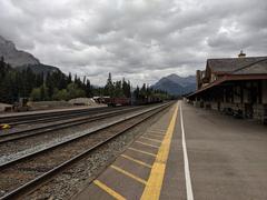 scenic view of Banff National Park with mountains, trees, and a cloudy sky