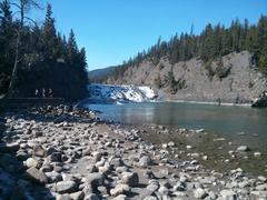 A river flowing through Banff National Park with mountains in the background