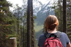 Hiker looking at mountainous landscape in Alberta