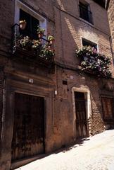 cityscape of Toledo, Spain featuring historic buildings and the Tagus River