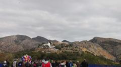 View of Saint Mary Magdalene and Castell Vell castle during Romería de les Canyes pilgrimage