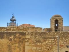 Castell de Peníscola entrance bastion and sentry box with lighthouse in the background