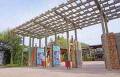 Faunia park entrance with large welcoming sign and surrounding greenery