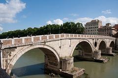 Pont Sisto in Rome with a view of the Tiber River and cityscape