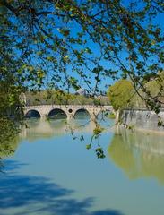 Spring at Ponte Sisto with people walking on the bridge