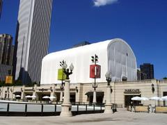 Cloud Gate covered by a tent during construction