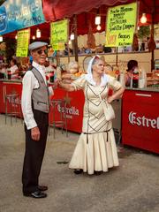 chulapos couple in traditional dress during Virgen de la Paloma celebrations in Madrid