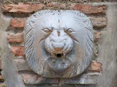 Lion head figurehead water spout in Puerta Oscura Gardens, Málaga