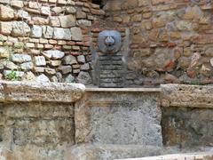 lion-shaped figurehead water spout in Puerta Oscura Gardens, Málaga