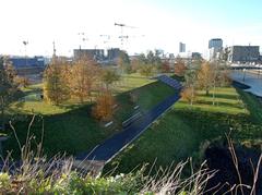 Baakenpark in Hamburg with various levels and areas for sports, play, and relaxation, view from Himmelsberg