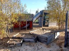 Baakenpark playground in Hamburg with wooden houses and water play area